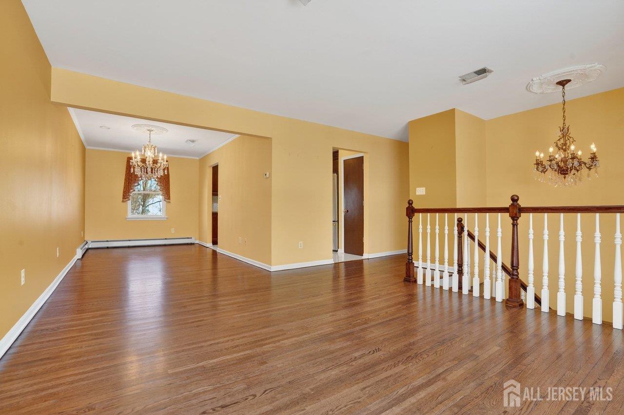 1 Wakefield Drive Edison, NJ 08820 - Photo 6 of 29 a view of an entryway with wooden floor