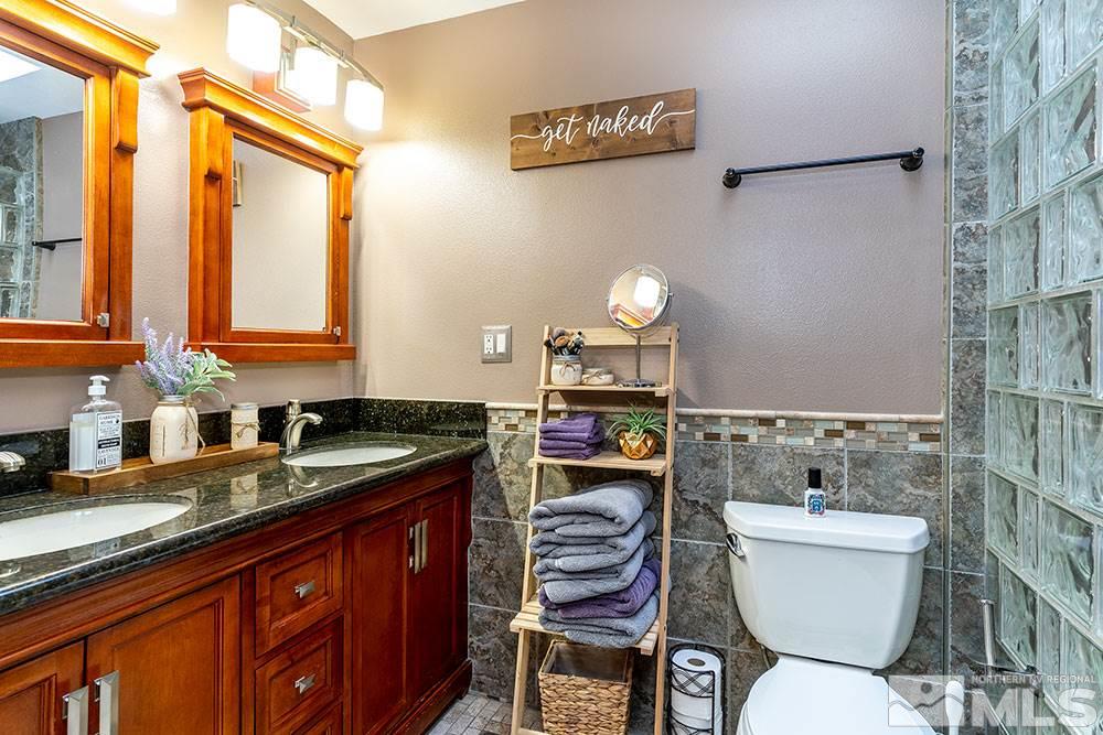 2075 Marsh Avenue Reno, NV 89509 - Photo 17 of 32 a bathroom with a sink and a toilet