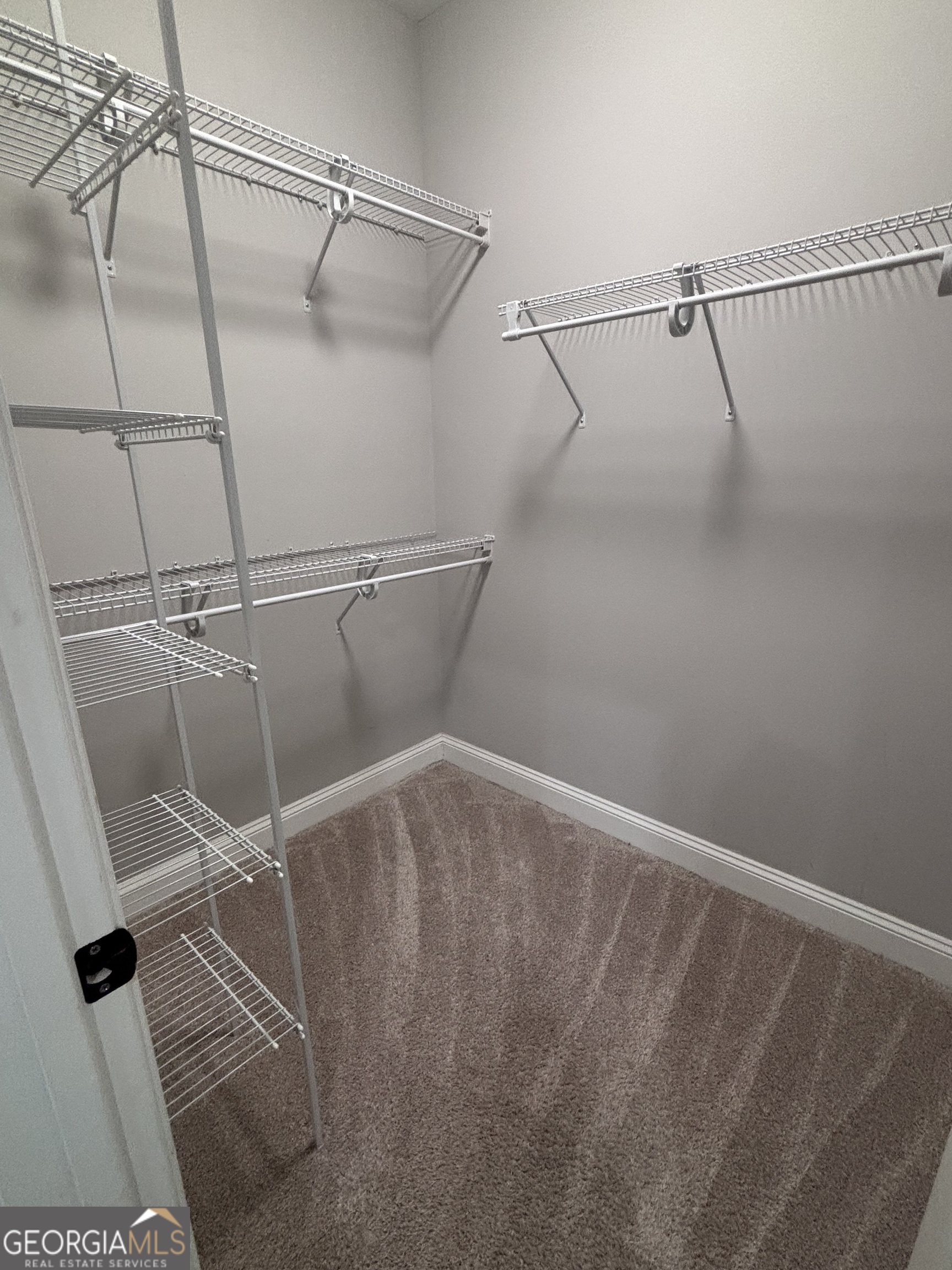 106 Logans Way Kingsland, GA 31548 - Photo 13 of 15 a view of a room with racks on the wall