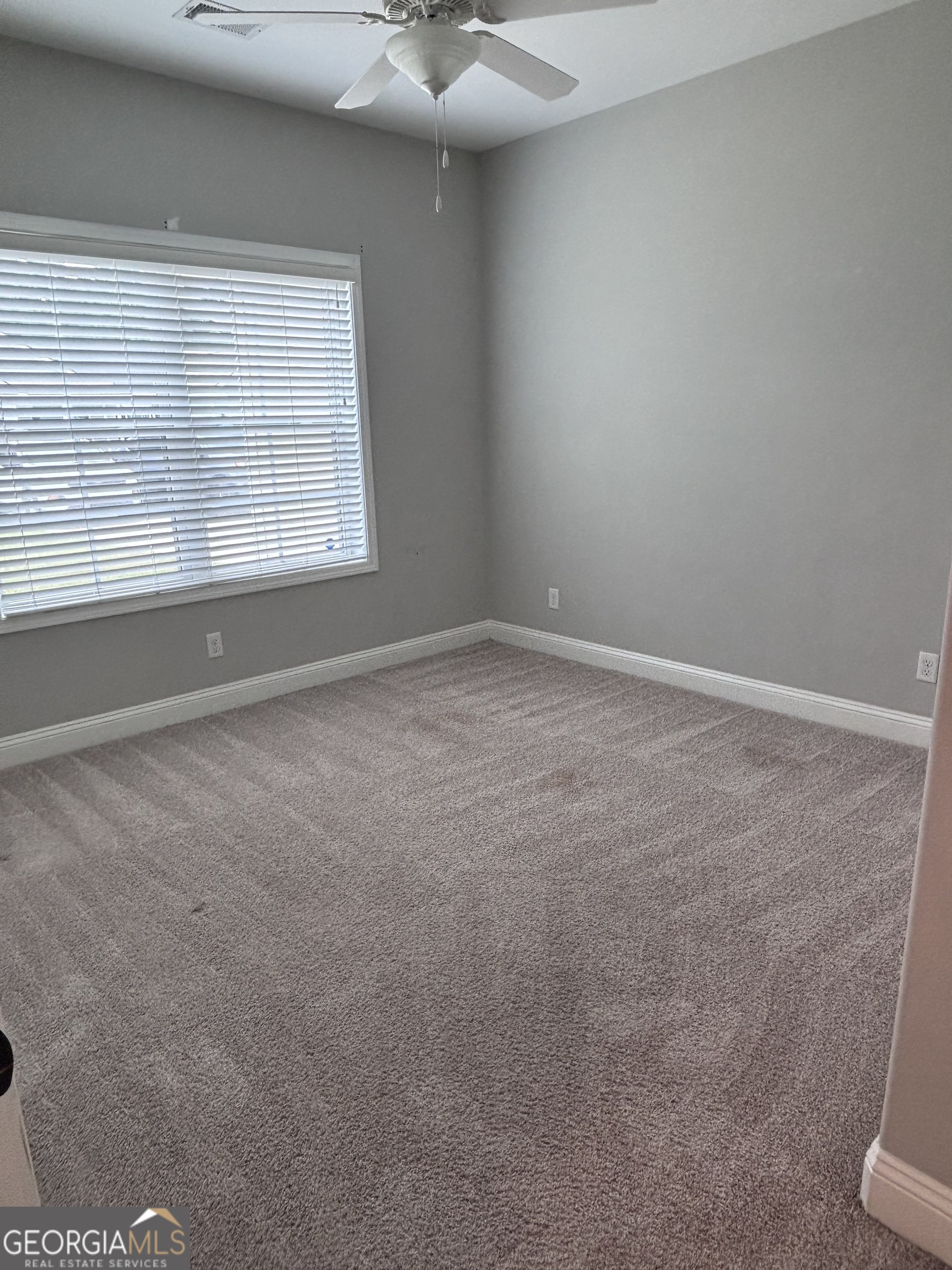 106 Logans Way Kingsland, GA 31548 - Photo 3 of 15 an empty room with a window