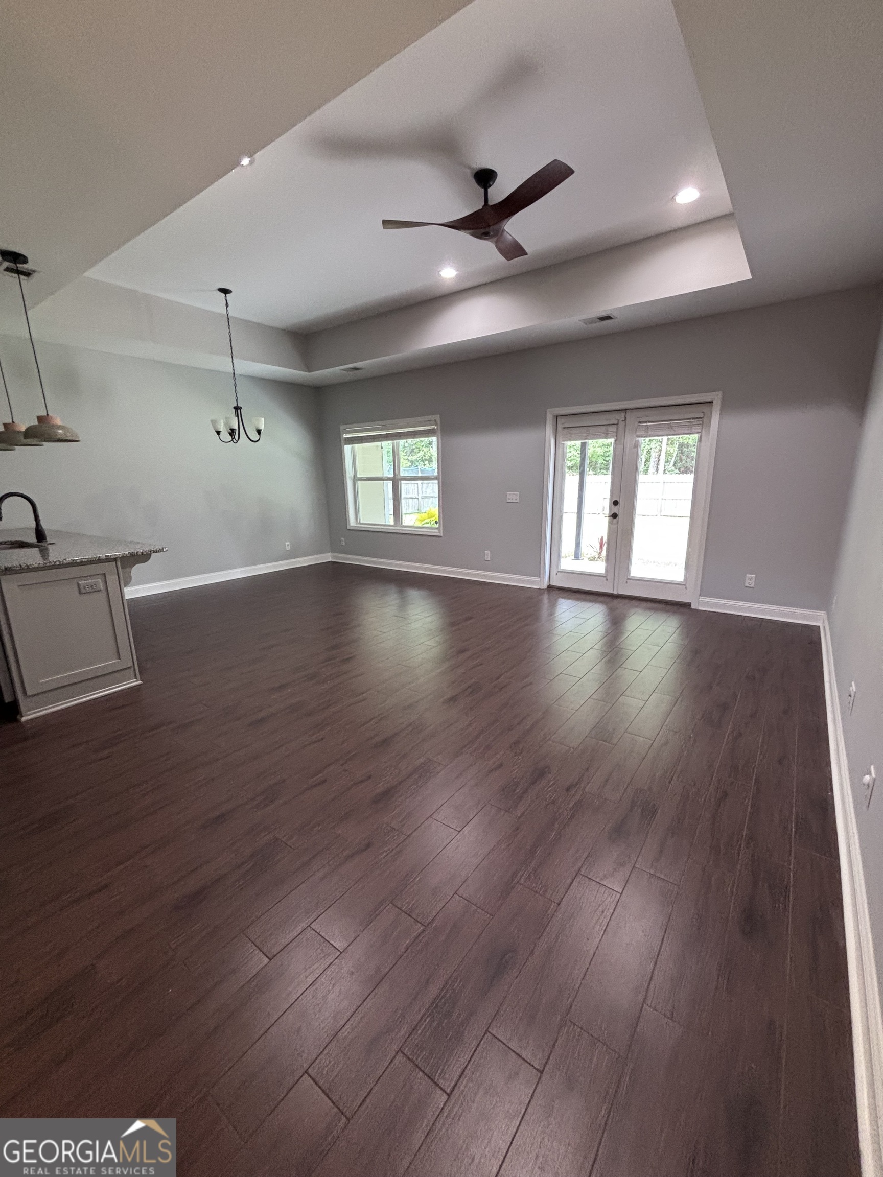 106 Logans Way Kingsland, GA 31548 - Photo 4 of 15 a view of an empty room with wooden floor and a window