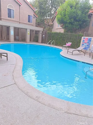 a view of a lake with a house and a yard