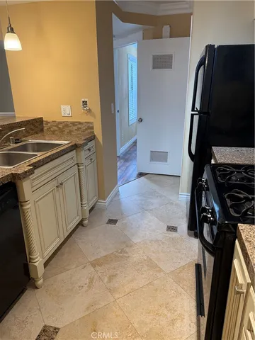 a kitchen with a sink and a stove