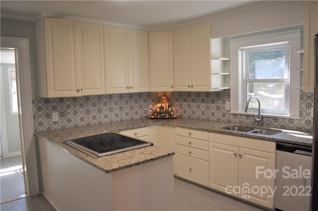1301 Jackson Road Gastonia, NC 28052 - Photo 15 of 44 a kitchen with granite countertop white cabinets and white appliances