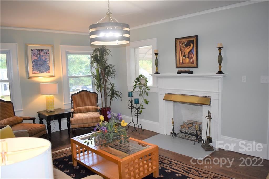 1301 Jackson Road Gastonia, NC 28052 - Photo 20 of 44 a living room with furniture a chandelier and a window