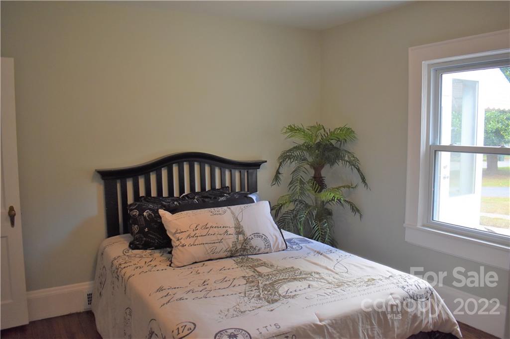 1301 Jackson Road Gastonia, NC 28052 - Photo 25 of 44 a large bed sitting in a bedroom next to a window