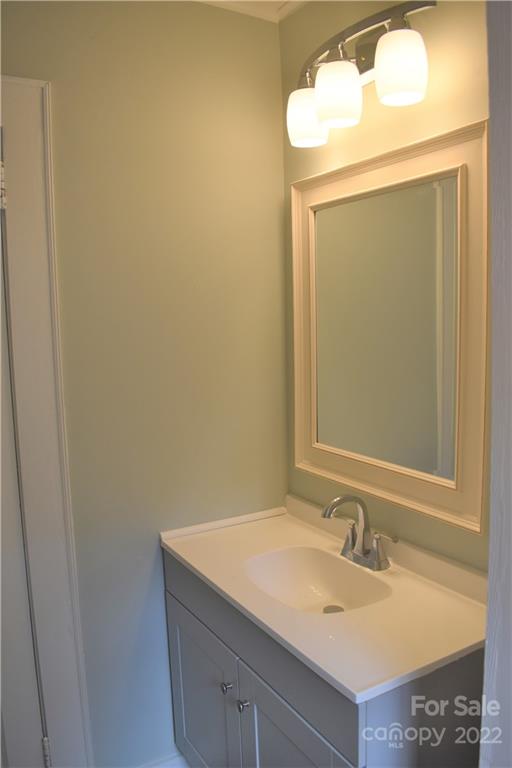 1301 Jackson Road Gastonia, NC 28052 - Photo 27 of 44 a bathroom with a granite countertop sink and a mirror