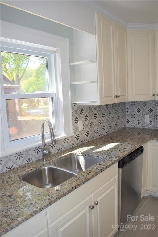 1301 Jackson Road Gastonia, NC 28052 - Photo 30 of 44 a kitchen with granite countertop a sink and a window