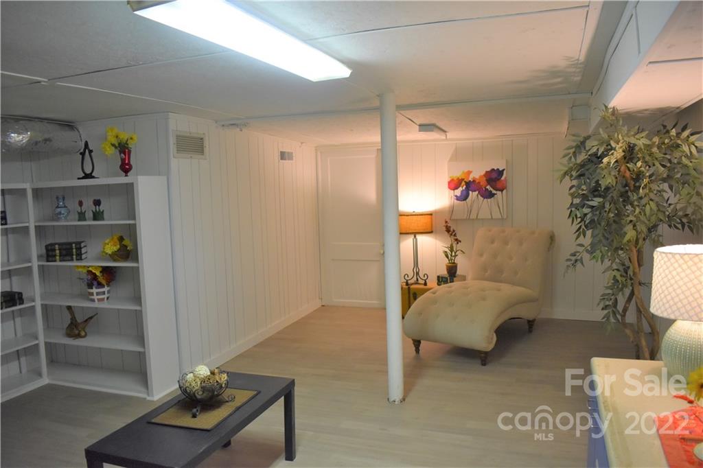 1301 Jackson Road Gastonia, NC 28052 - Photo 43 of 44 a bedroom with a bed and a potted plant