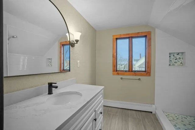 a bathroom with a sink and a mirror