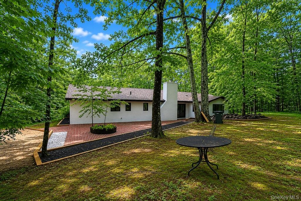 18 Hillside View Road Mahopac, NY 10541 - Photo 5 of 42 a view of a backyard with a table and chair