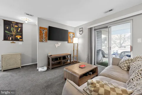 a bedroom with furniture and a fireplace