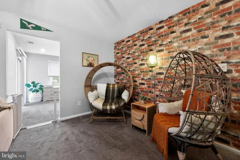 a view of an entryway with a table and chairs