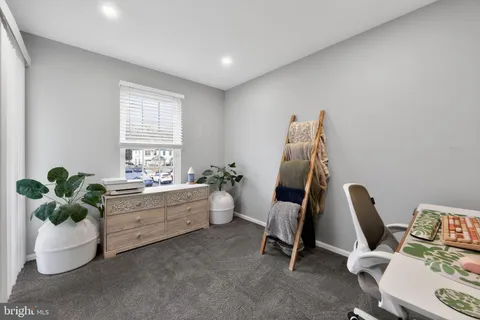 a room with furniture and a potted plant