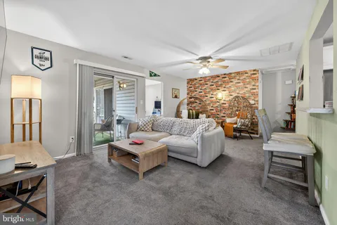 a bedroom with furniture and a chandelier