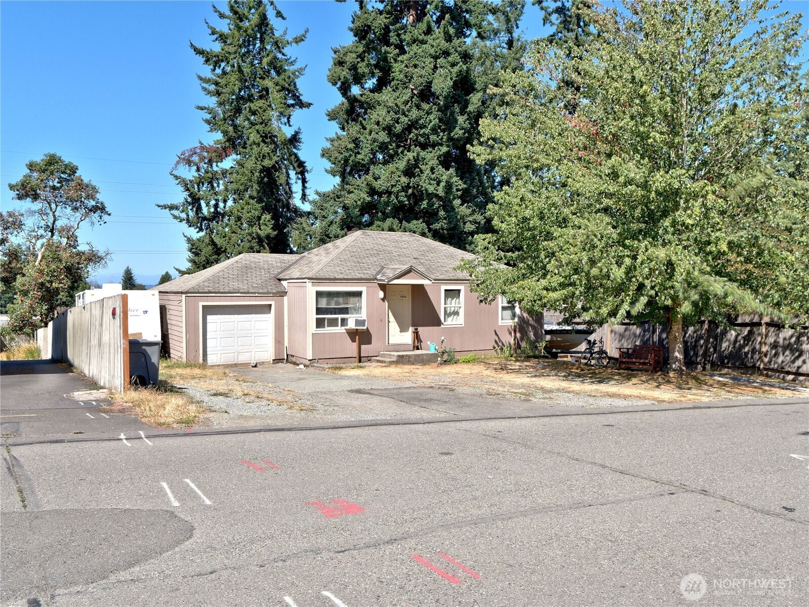 1409 Monroe Avenue Northeast Renton, WA 98056 - Photo 2 of 17 a front view of a house with a yard