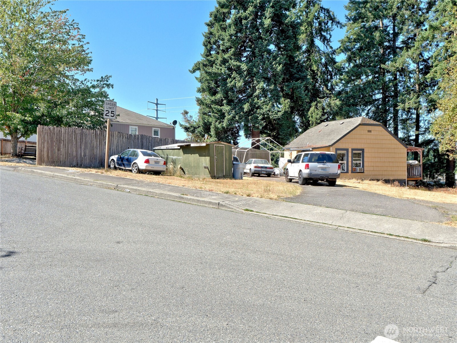 1409 Monroe Avenue Northeast Renton, WA 98056 - Photo 5 of 17 front view of a house with a patio and a fire pit