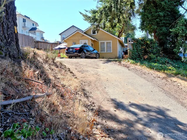 an aerial view of a house with a yard