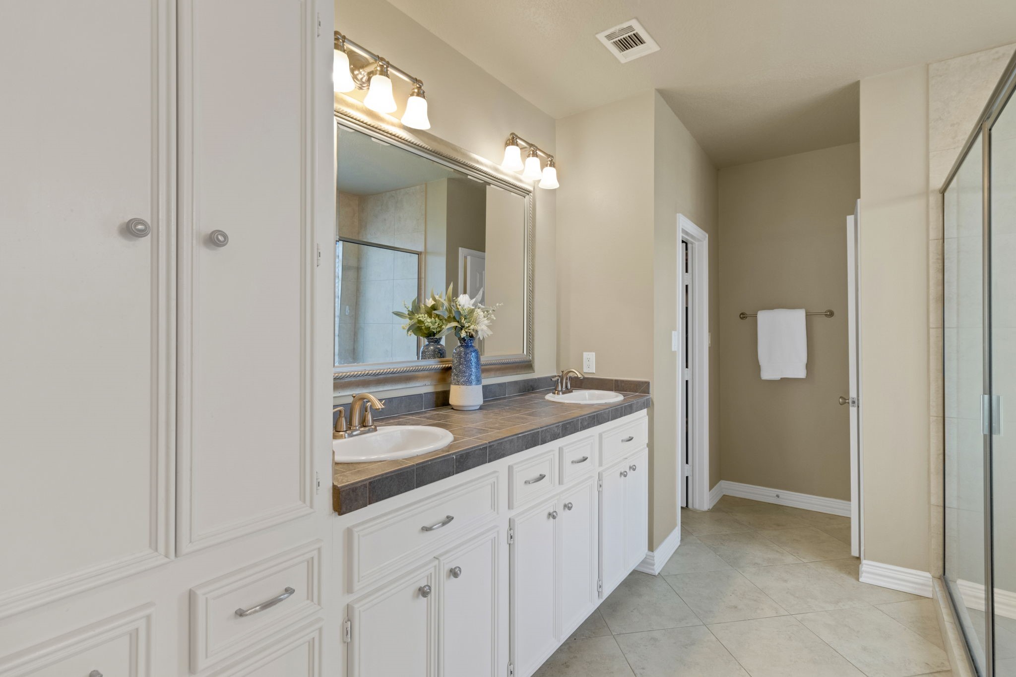 290 Harbor Run Drive Coldspring, TX 77331 - Photo 21 of 42 Primary ensuite bathroom with dual sinks and walk in shower