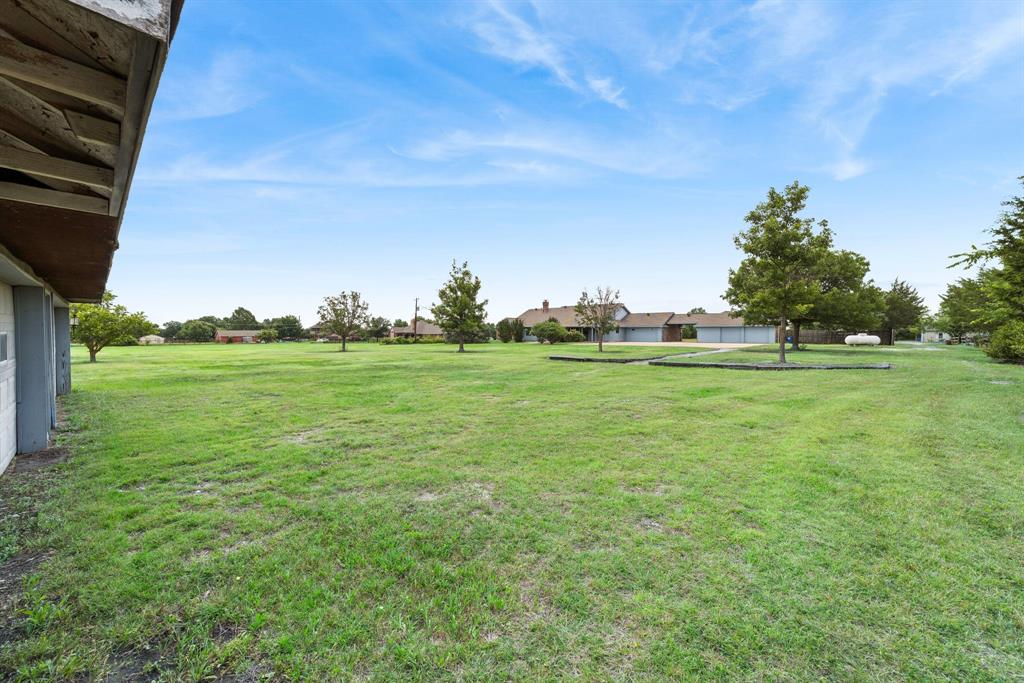 1175 Bloom Street Lucas, TX 75002 - Photo 34 of 36 a view of a green field with wooden fence