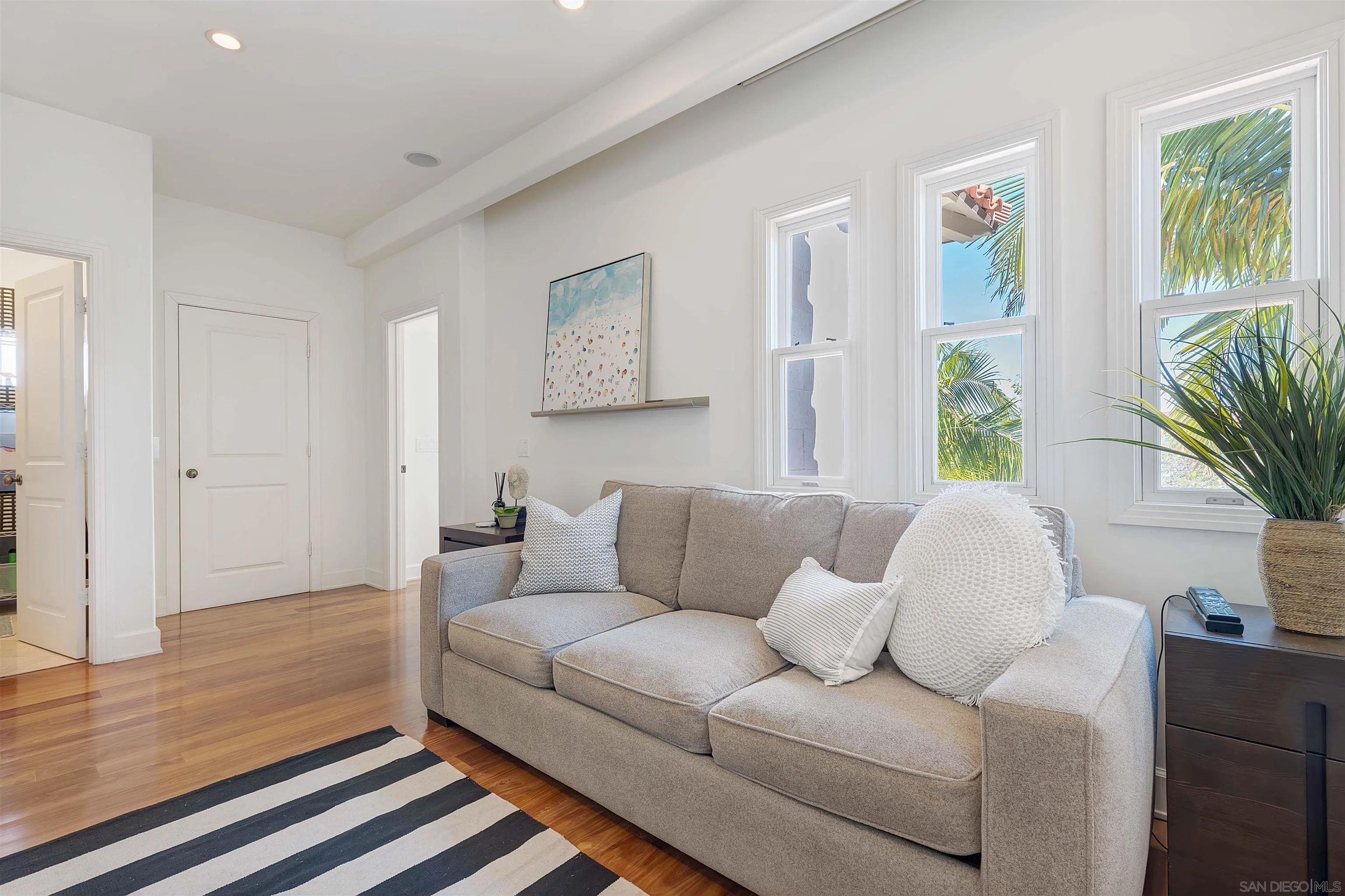 1022 G Coronado, CA 92118 - Photo 13 of 29 a living room with furniture and a large window