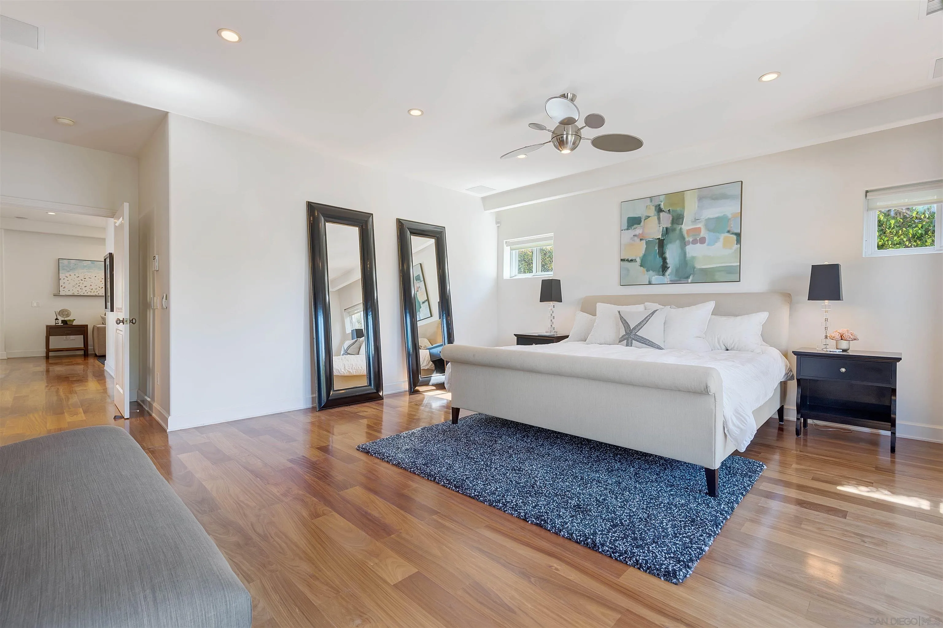 1022 G Coronado, CA 92118 - Photo 14 of 29 a bedroom with a large bed and a chandelier