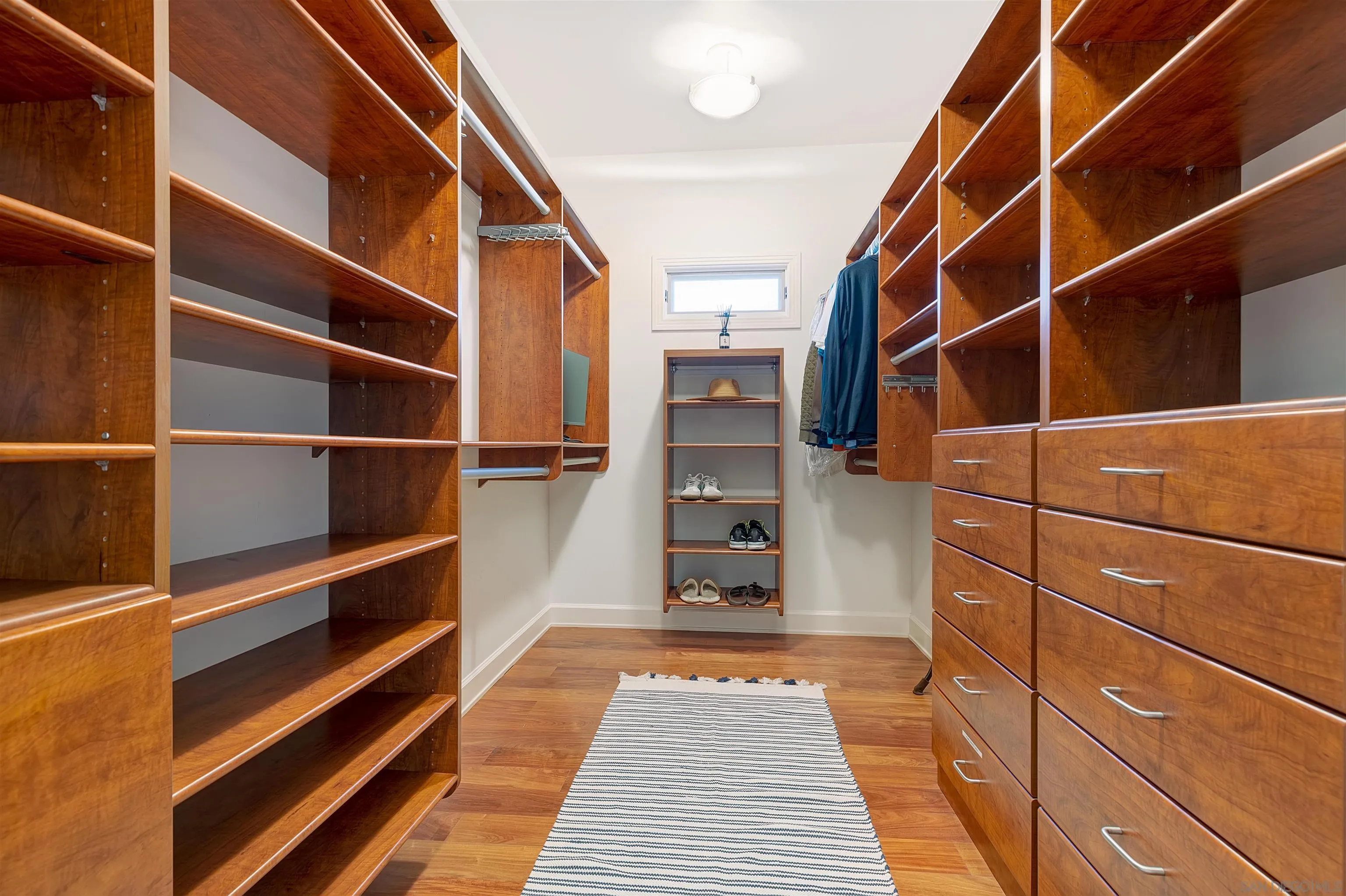 1022 G Coronado, CA 92118 - Photo 18 of 29 a view of walk in closet with empty racks