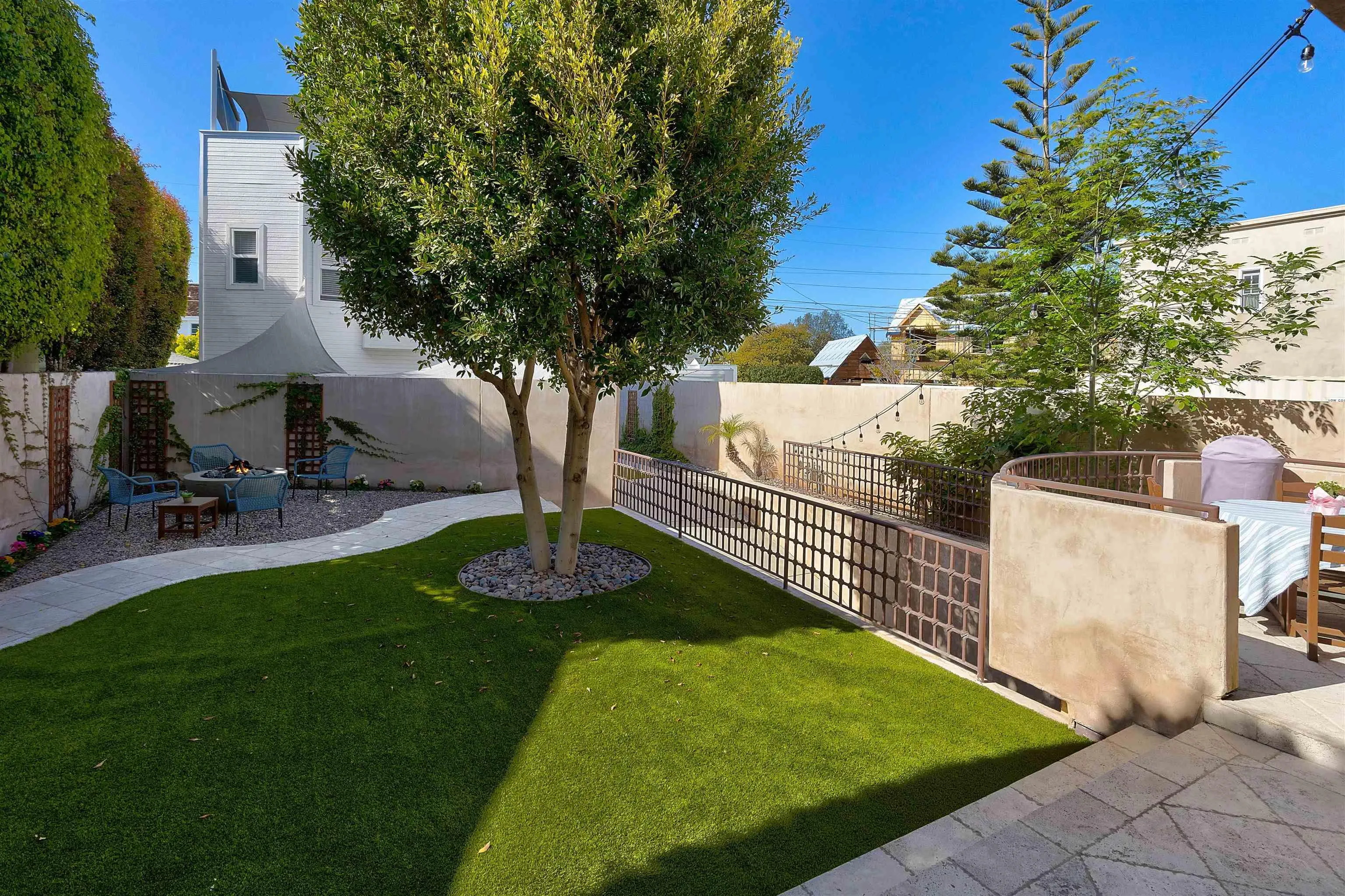 1022 G Coronado, CA 92118 - Photo 28 of 29 a garden with trees in front of it