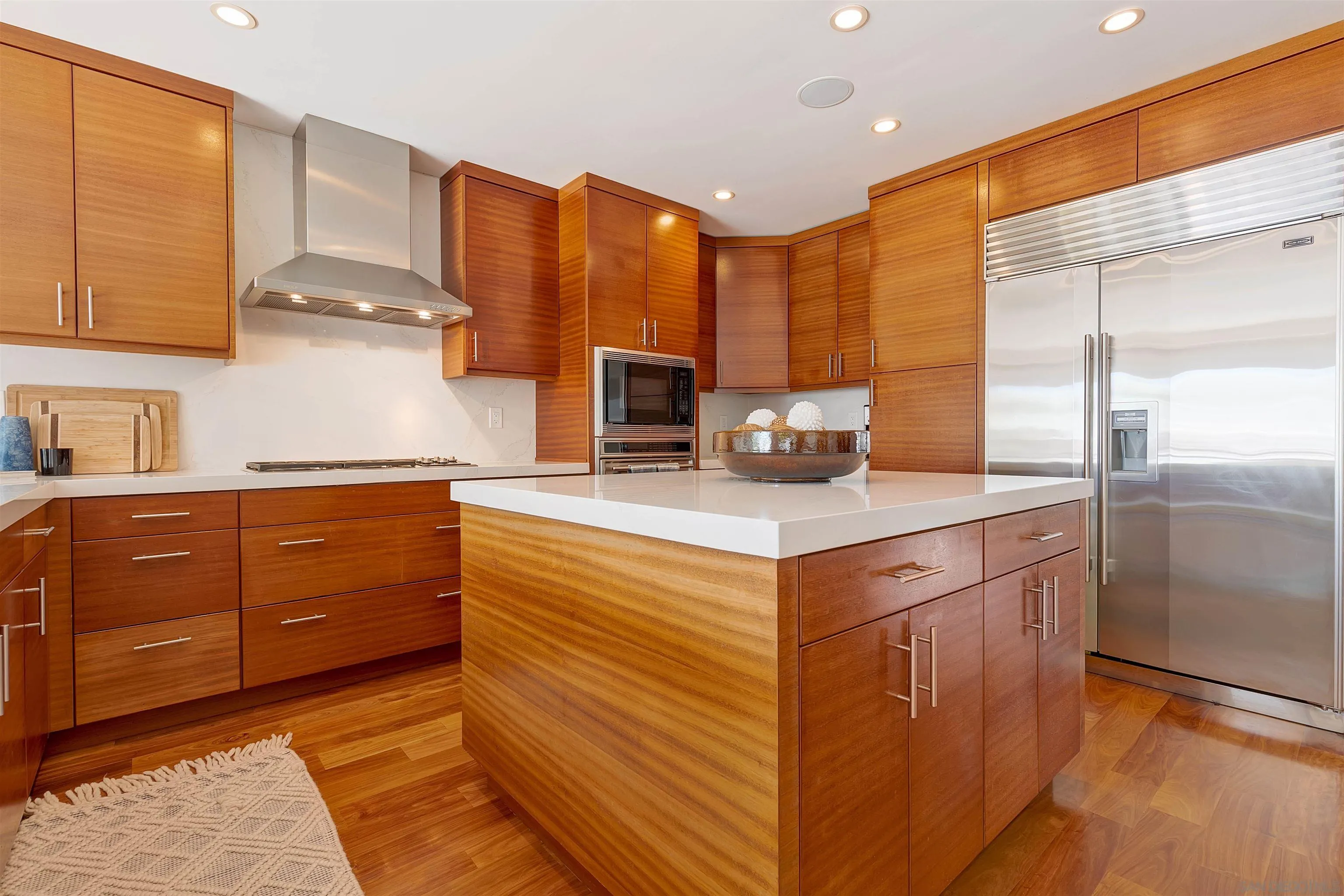 1022 G Coronado, CA 92118 - Photo 5 of 29 a kitchen with stainless steel appliances granite countertop a sink a stove and a refrigerator