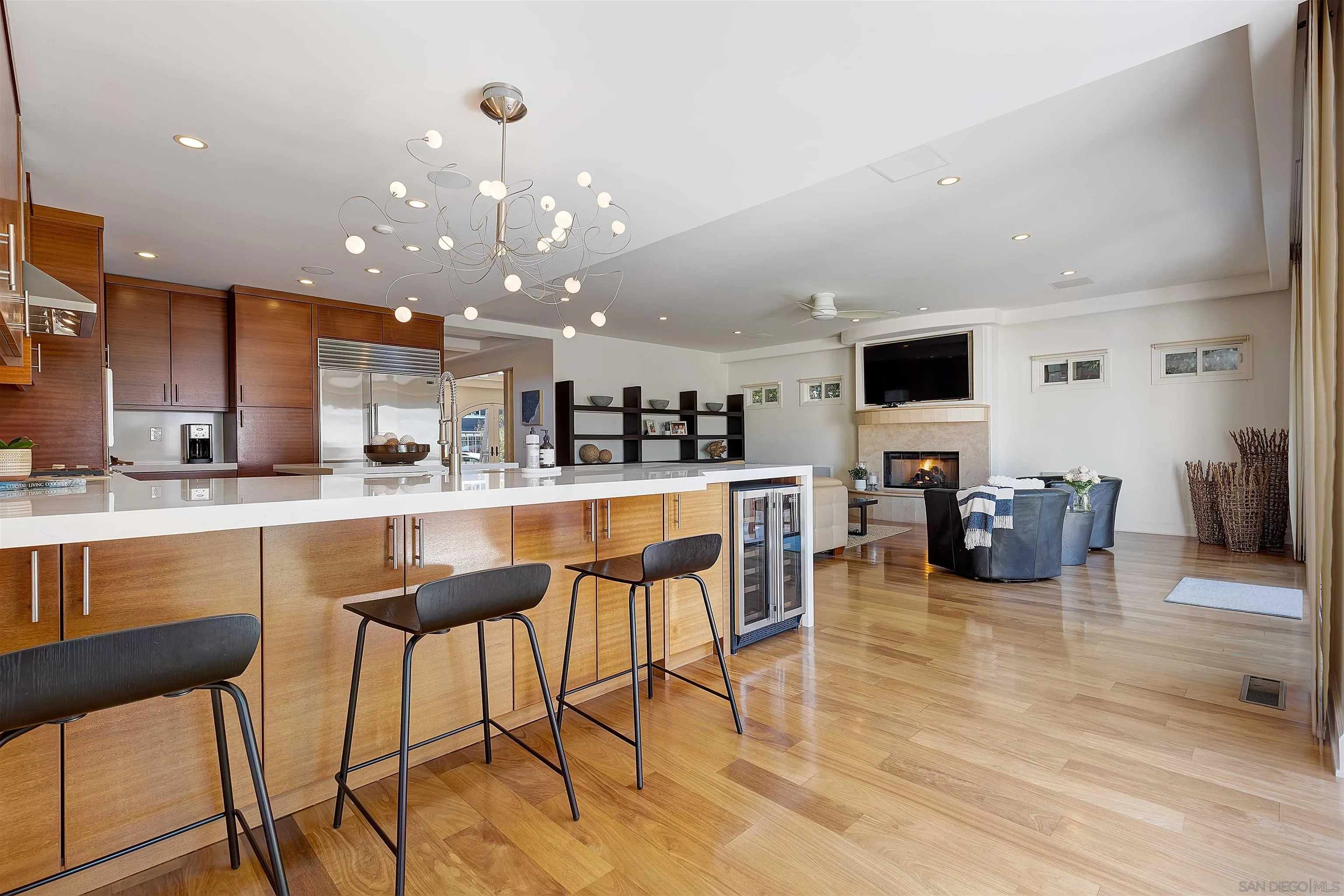1022 G Coronado, CA 92118 - Photo 6 of 29 a kitchen with stainless steel appliances kitchen island granite countertop a table and chairs in it