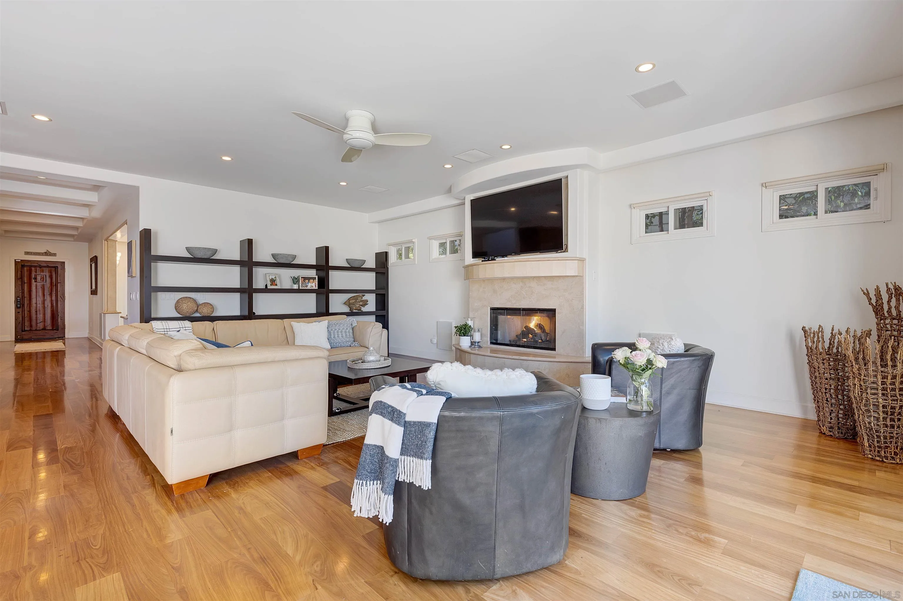 1022 G Coronado, CA 92118 - Photo 8 of 29 a living room with furniture a fireplace and a flat screen tv