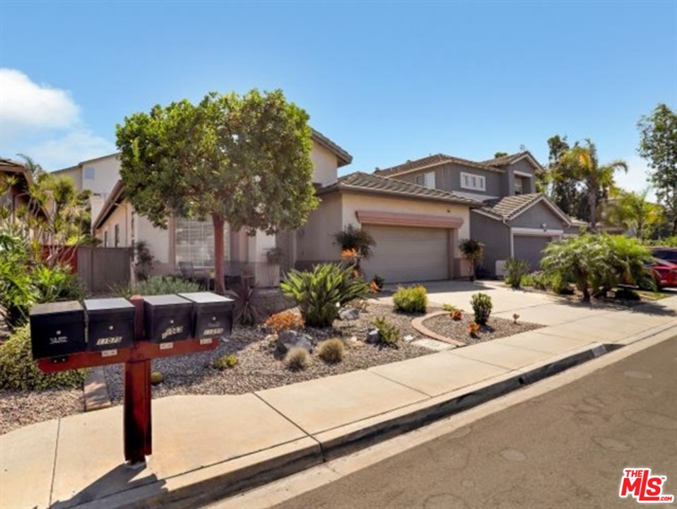 11063 Mulgrave Road San Diego, CA 92131 - Photo 2 of 30 a view of a house with sitting area and garden