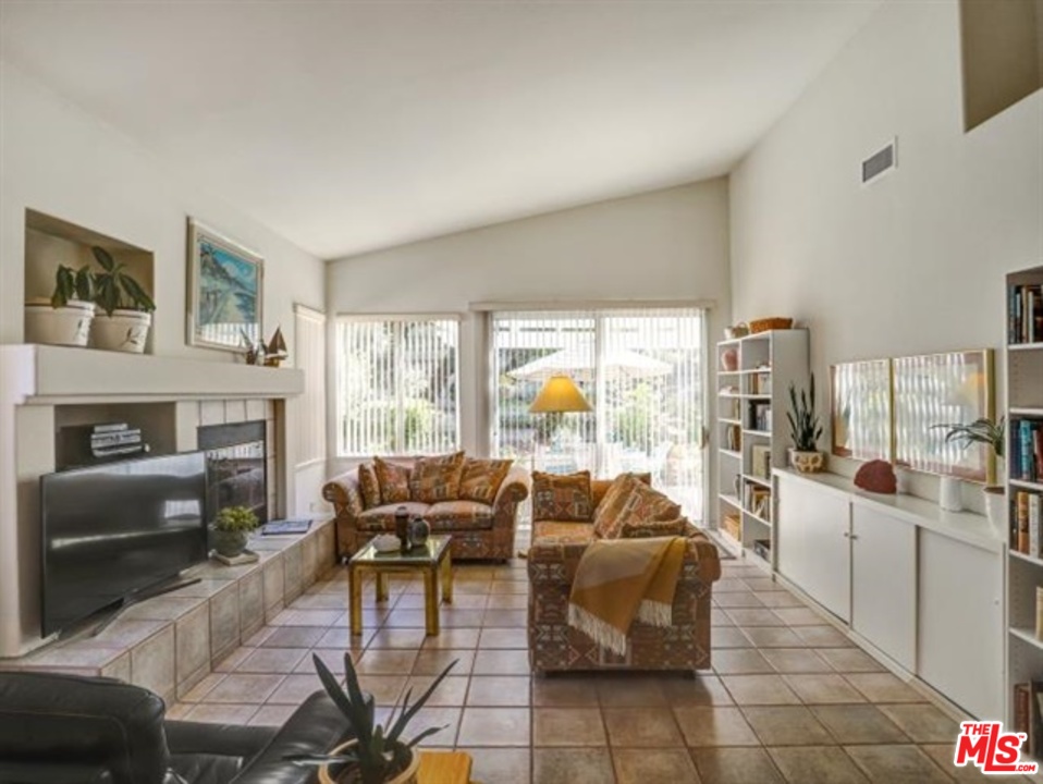 11063 Mulgrave Road San Diego, CA 92131 - Photo 13 of 30 a living room with furniture and a fireplace