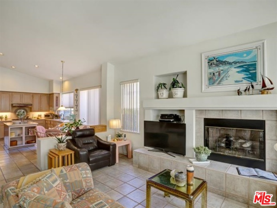11063 Mulgrave Road San Diego, CA 92131 - Photo 14 of 30 a living room with furniture fireplace and window