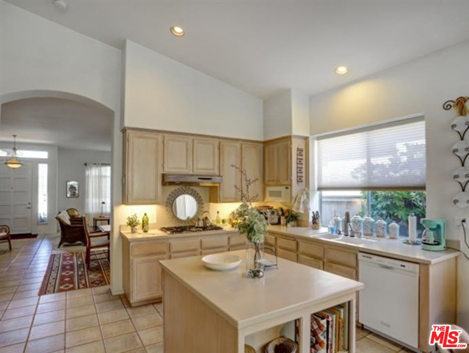 11063 Mulgrave Road San Diego, CA 92131 - Photo 16 of 30 a kitchen with a sink cabinets and counter space