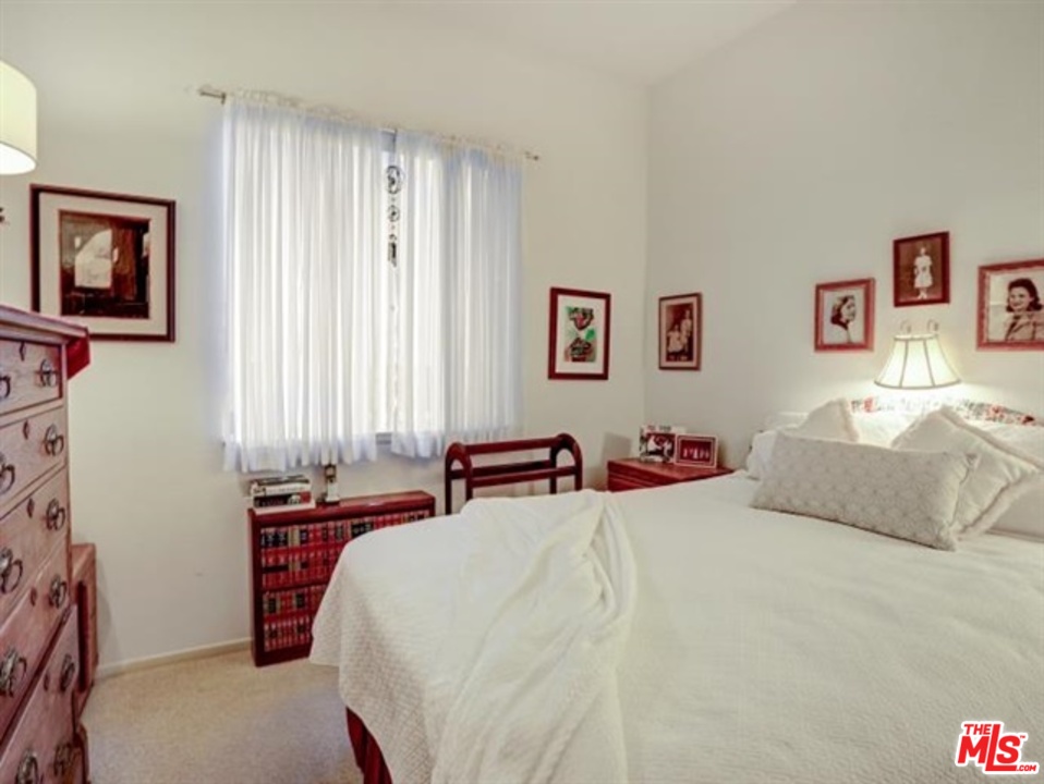 11063 Mulgrave Road San Diego, CA 92131 - Photo 20 of 30 a bedroom with a bed and a window