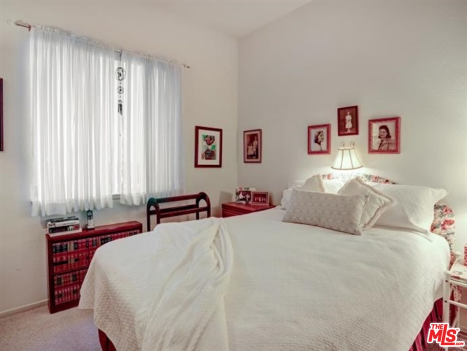 11063 Mulgrave Road San Diego, CA 92131 - Photo 21 of 30 a bedroom with a bed and a window