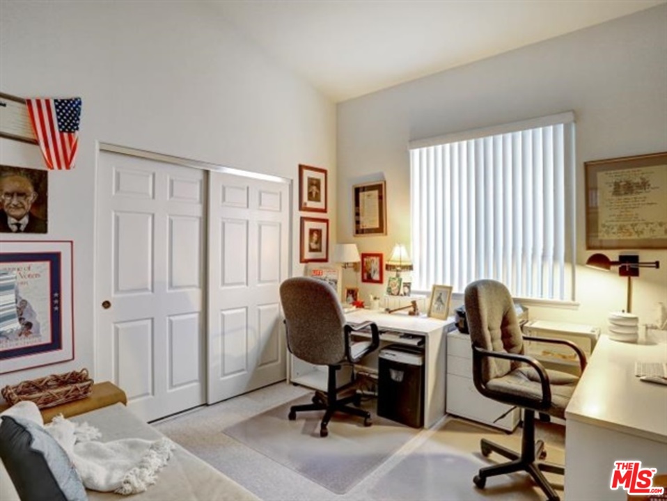 11063 Mulgrave Road San Diego, CA 92131 - Photo 22 of 30 a view of a workspace with furniture and a window