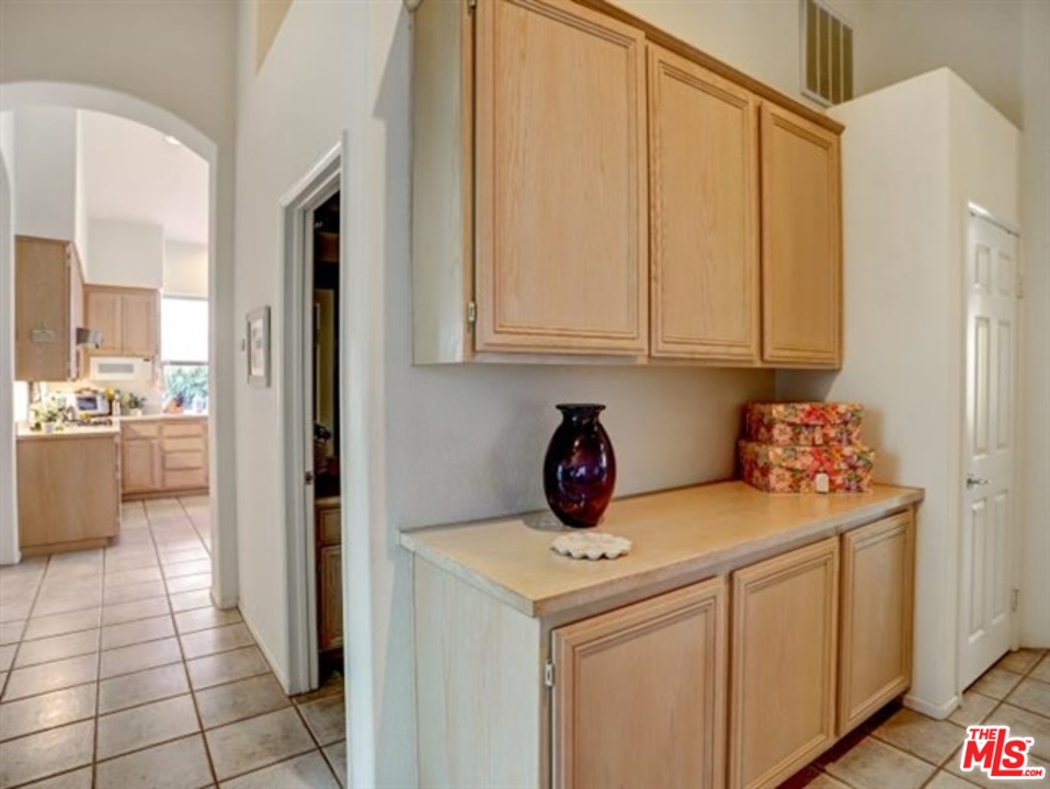 11063 Mulgrave Road San Diego, CA 92131 - Photo 23 of 30 a utility room with cabinets washer and dryer
