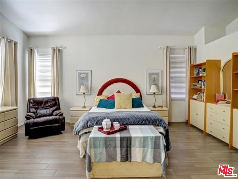 11063 Mulgrave Road San Diego, CA 92131 - Photo 25 of 30 a bedroom with furniture and a window