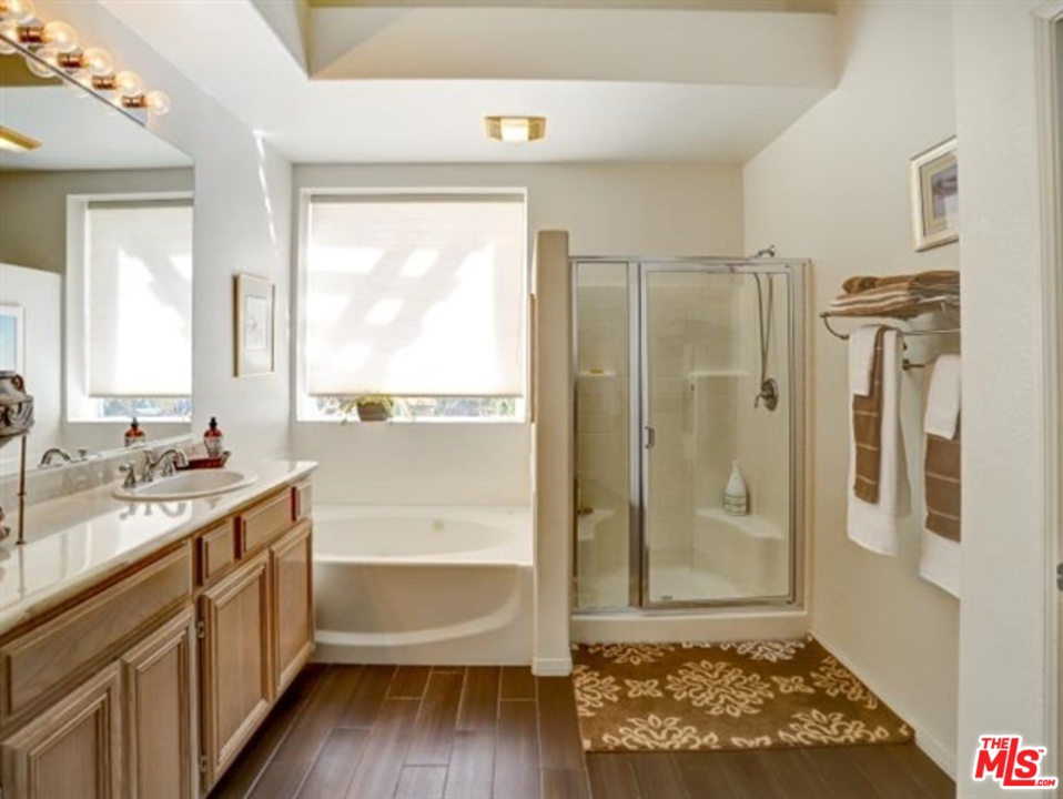11063 Mulgrave Road San Diego, CA 92131 - Photo 28 of 30 a bathroom with a tub shower vanity and a sink