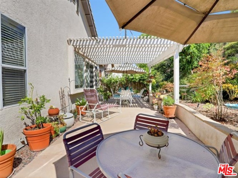11063 Mulgrave Road San Diego, CA 92131 - Photo 30 of 30 a outdoor space with patio furniture and potted plants