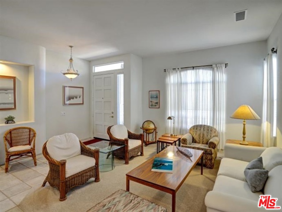 11063 Mulgrave Road San Diego, CA 92131 - Photo 6 of 30 a living room with furniture and a window