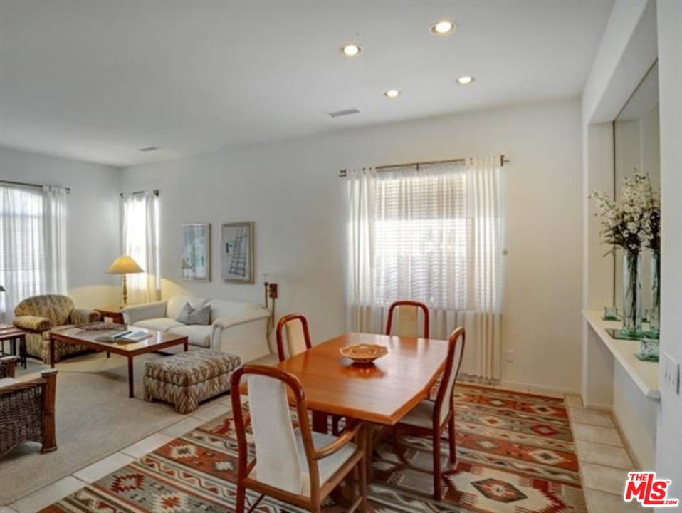 11063 Mulgrave Road San Diego, CA 92131 - Photo 7 of 30 a living room with furniture and a window