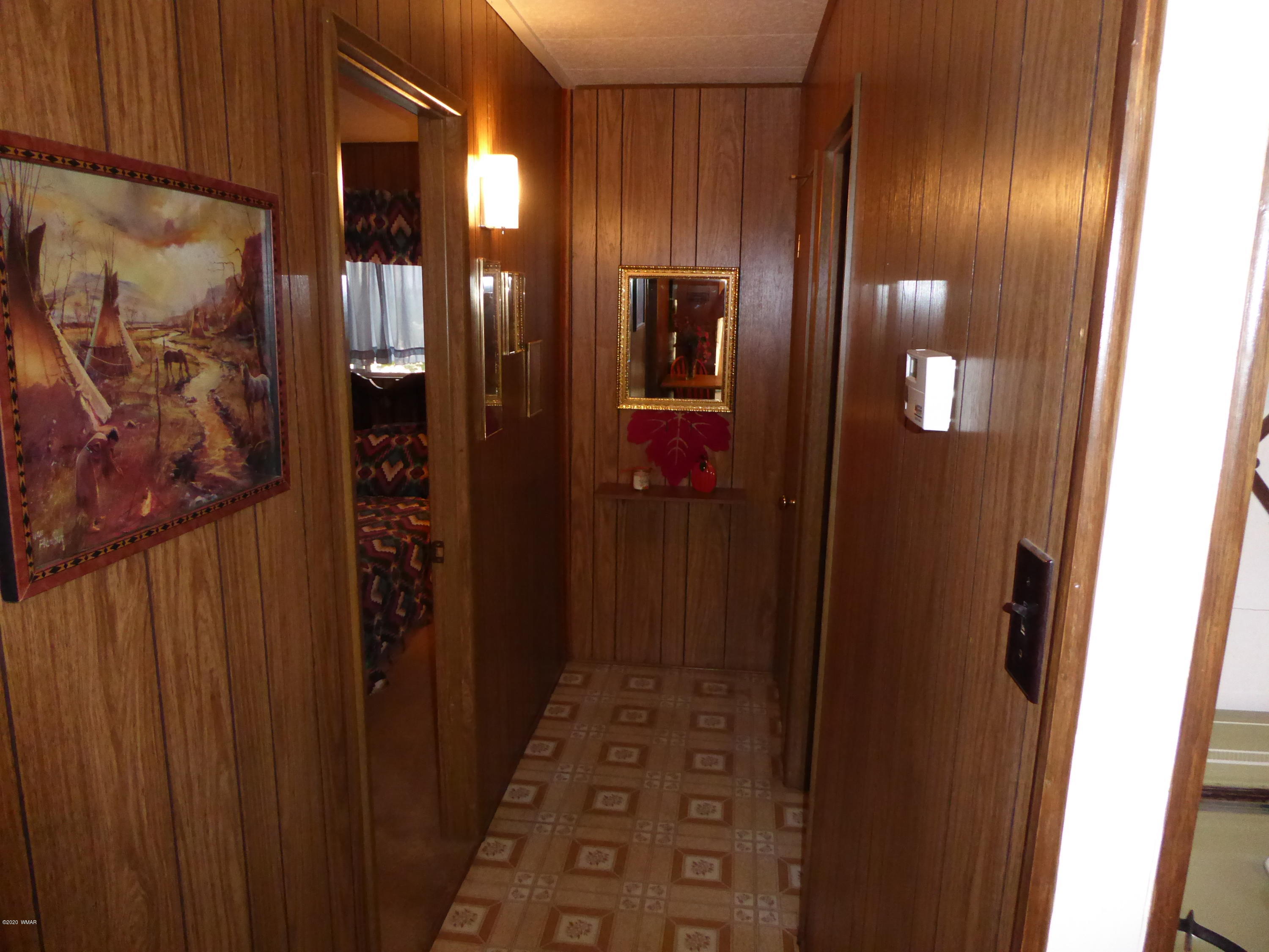 2898 Belle Road Overgaard, AZ 85933 - Photo 16 of 26 a bathroom with a glass door shower and sink