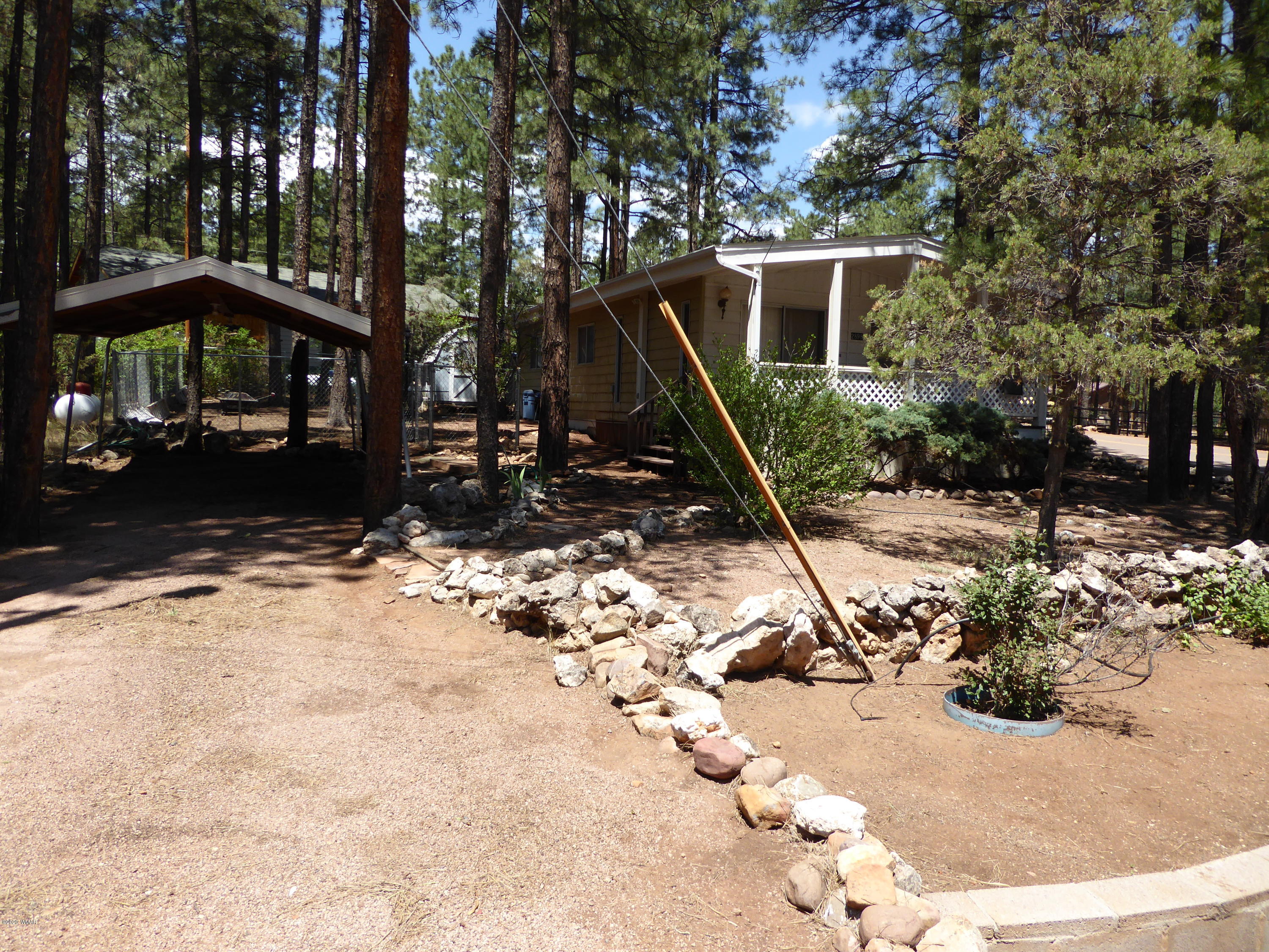2898 Belle Road Overgaard, AZ 85933 - Photo 24 of 26 a view of a house with a snow in the yard
