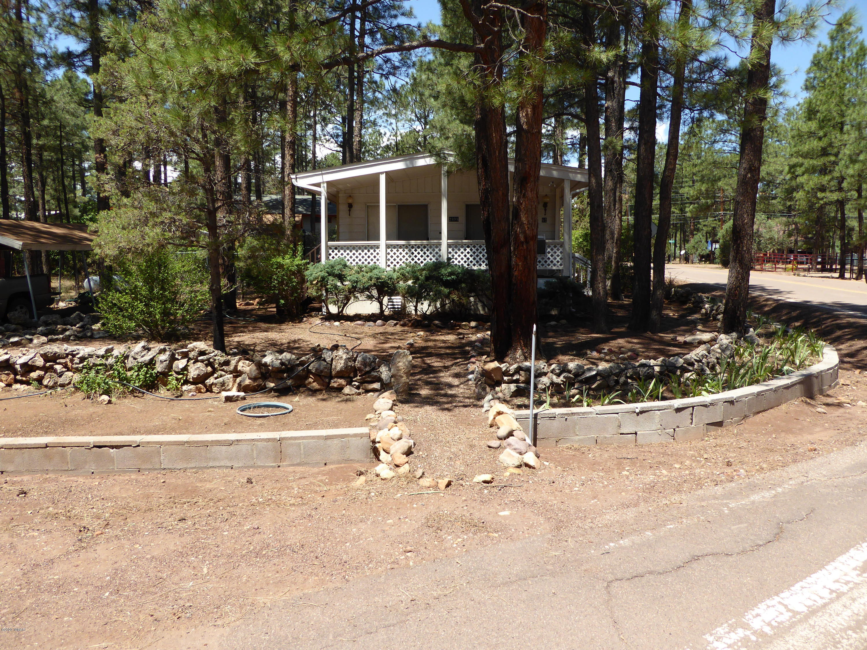 2898 Belle Road Overgaard, AZ 85933 - Photo 26 of 26 a view of a house with a yard