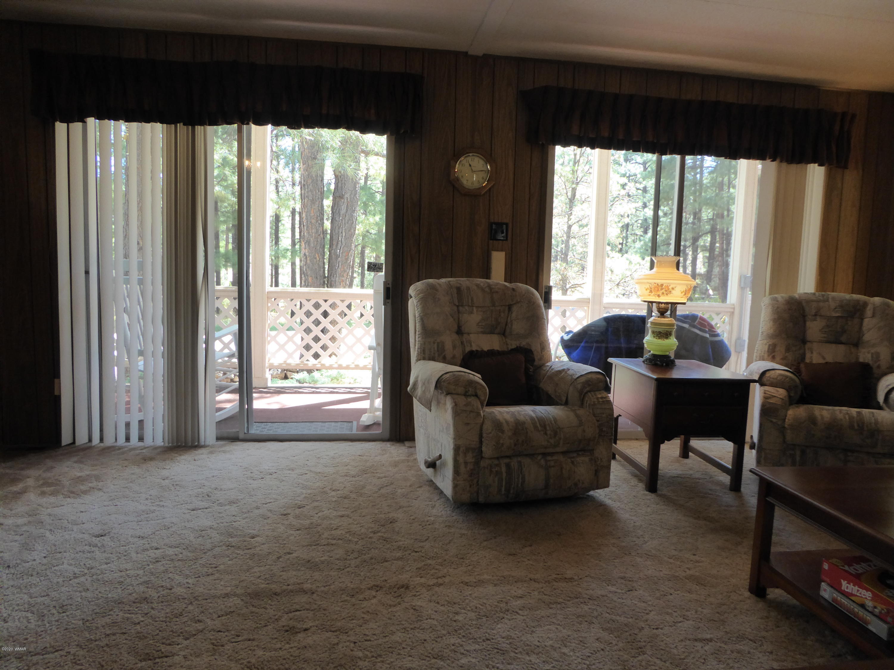 2898 Belle Road Overgaard, AZ 85933 - Photo 3 of 26 a living room with furniture and a large window