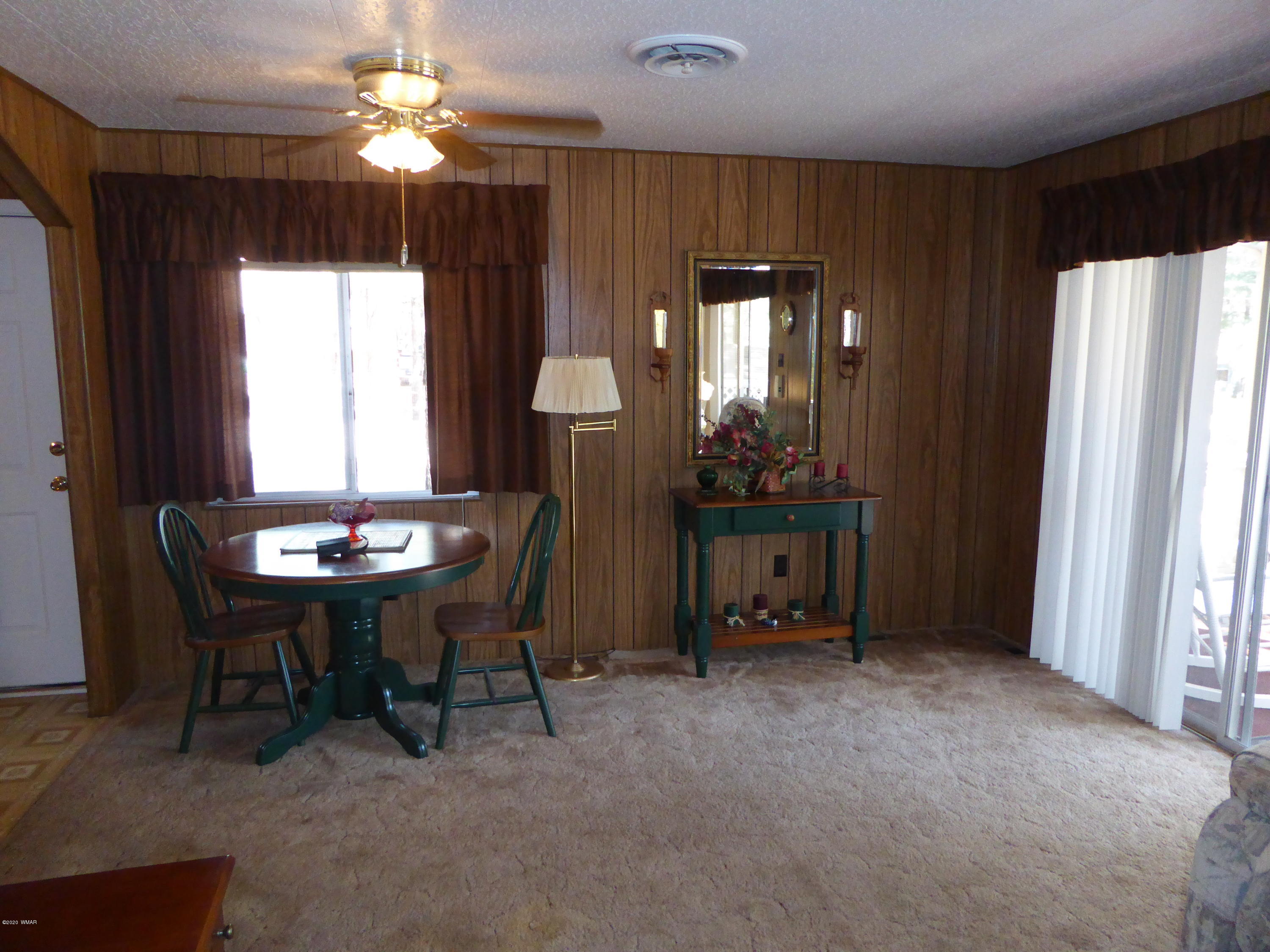 2898 Belle Road Overgaard, AZ 85933 - Photo 4 of 26 a view of a livingroom with furniture and a window