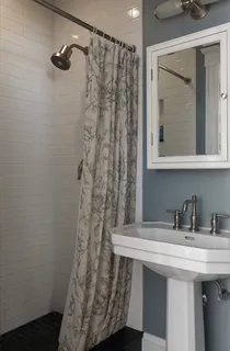 a bathroom with a sink and mirror